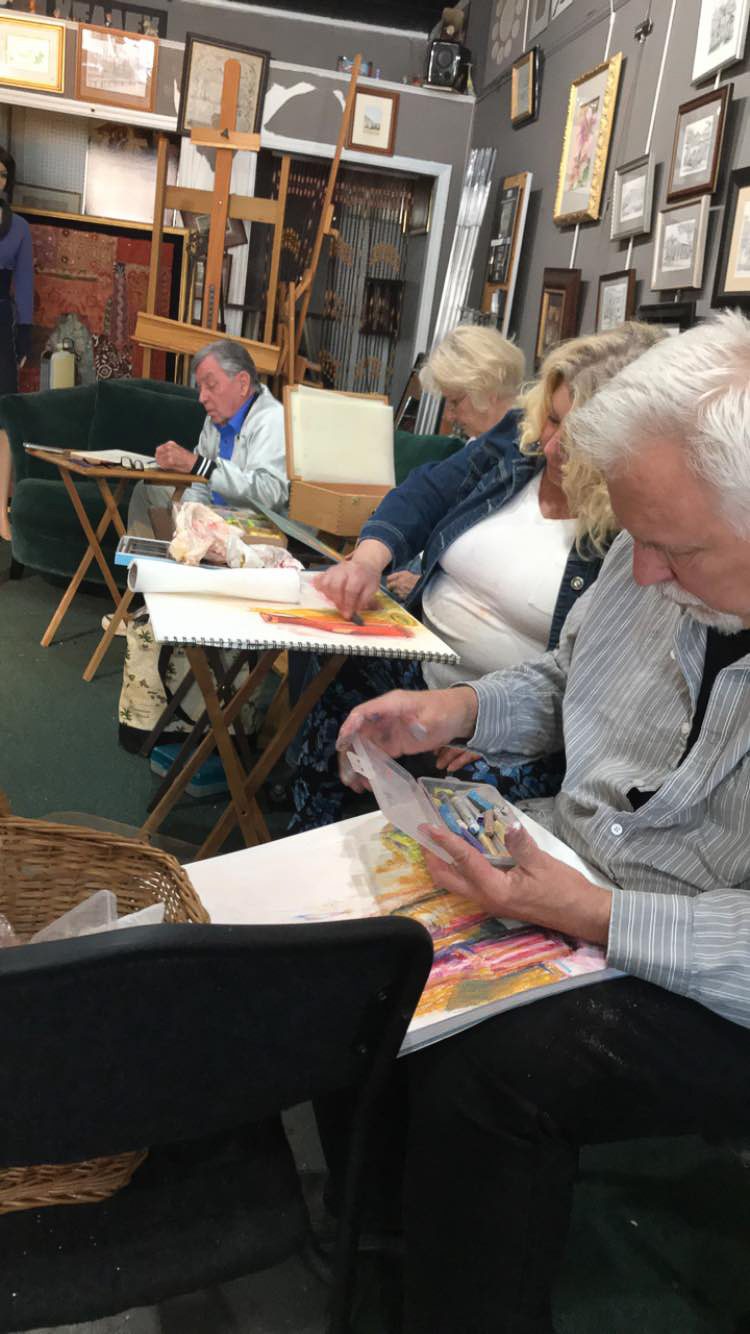 Art students painting at Magnolia House