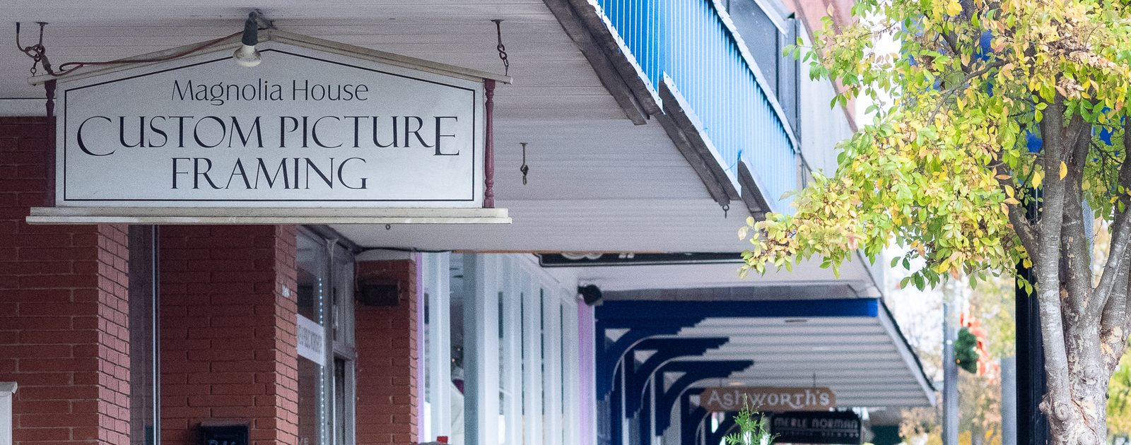 The Magnolia House shop sign on South Main Street